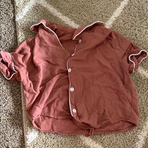 salmon colored shirt